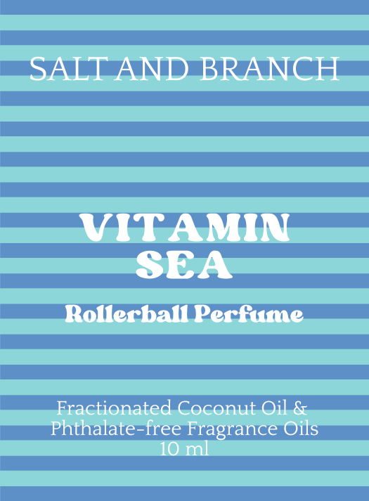 Blue and light blue horizontally striped label with white text reading 'SALT AND BRANCH', 'VITAMIN SEA', 'Rollerball Perfume', and 'Fractionated Coconut Oil & Phthalate-free Fragrance Oils 10 ml'.